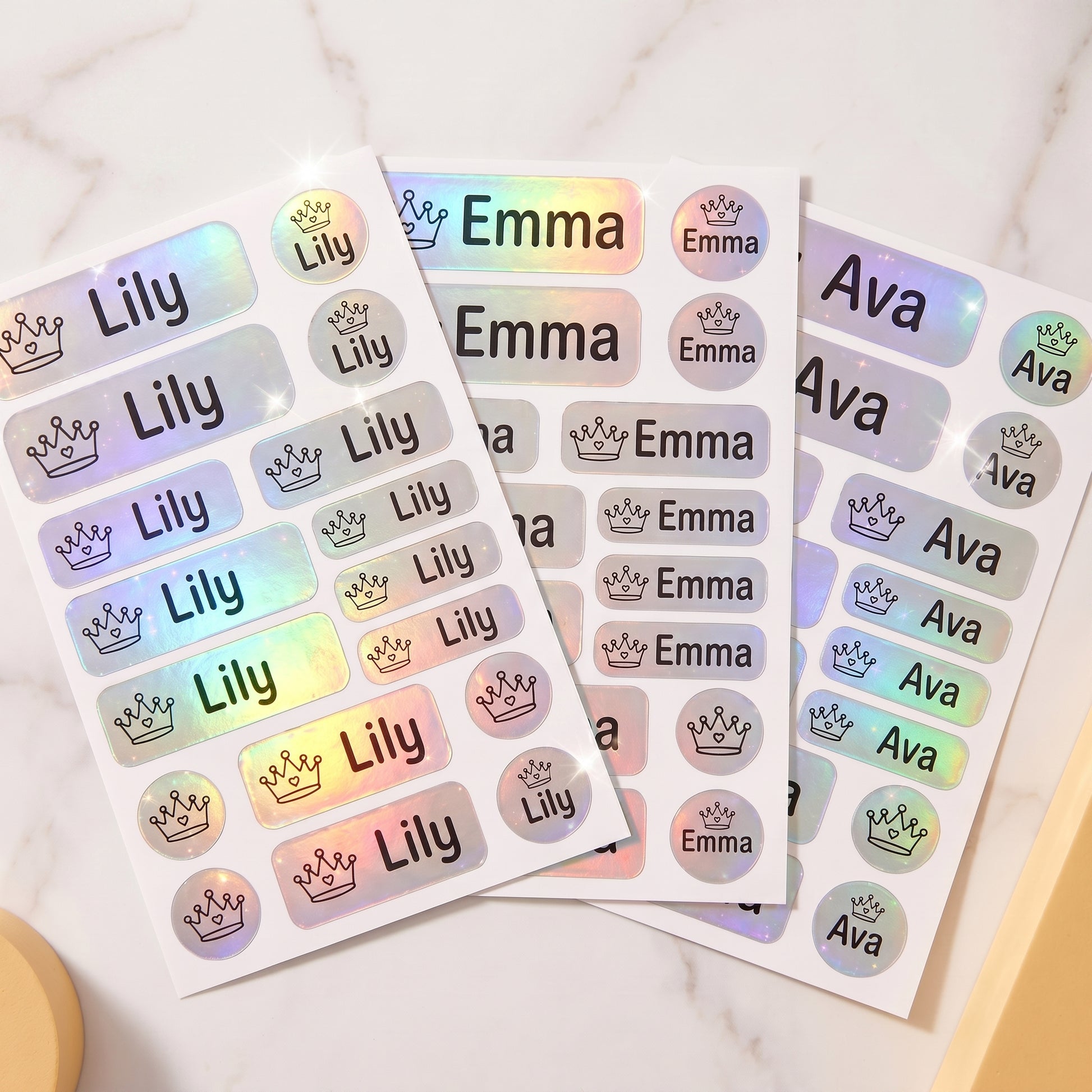 Holographic princess & castle name label sticker sheet close-up with rainbow shimmer