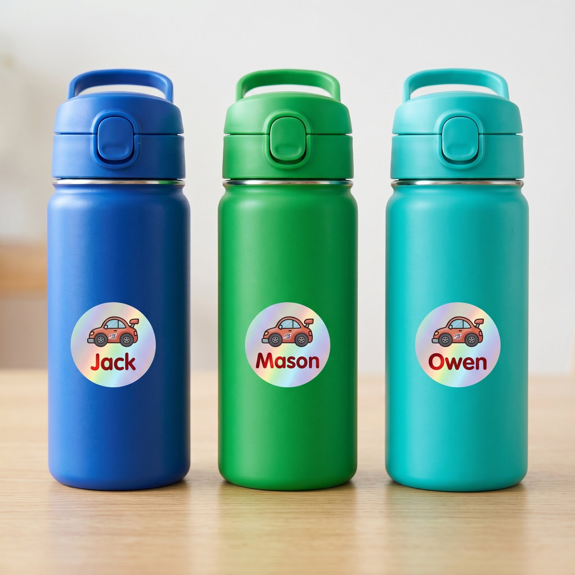 Personalized race cars name labels on three kids water bottles