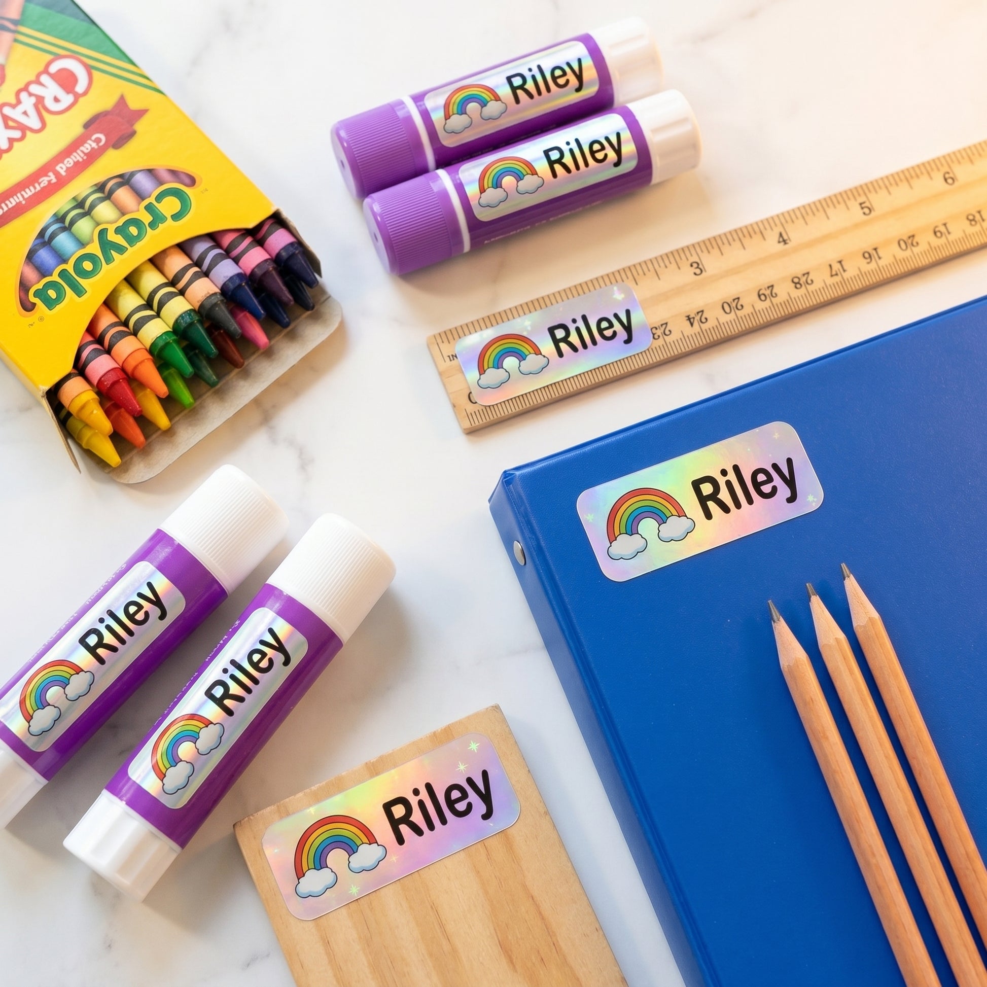 rainbow name labels on school supplies - crayons, glue, ruler, pencils, binder