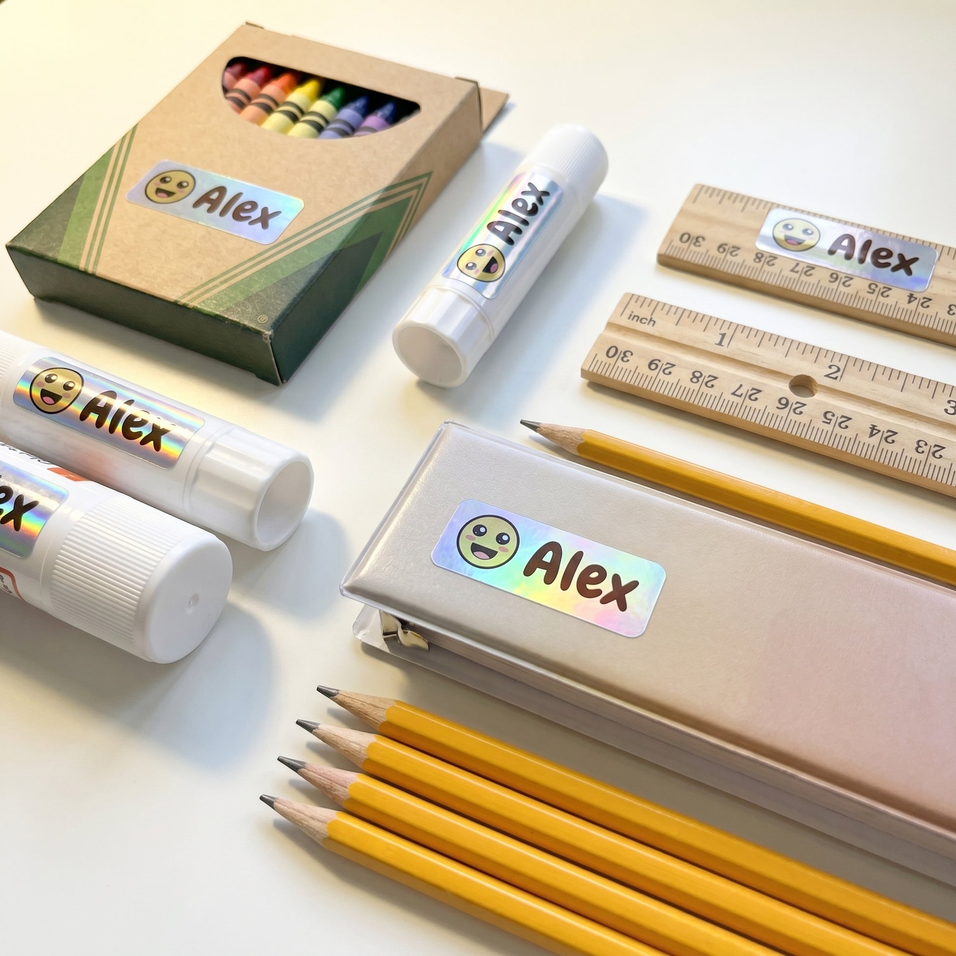 smiley name labels on school supplies - crayons, glue, ruler, pencils, binder