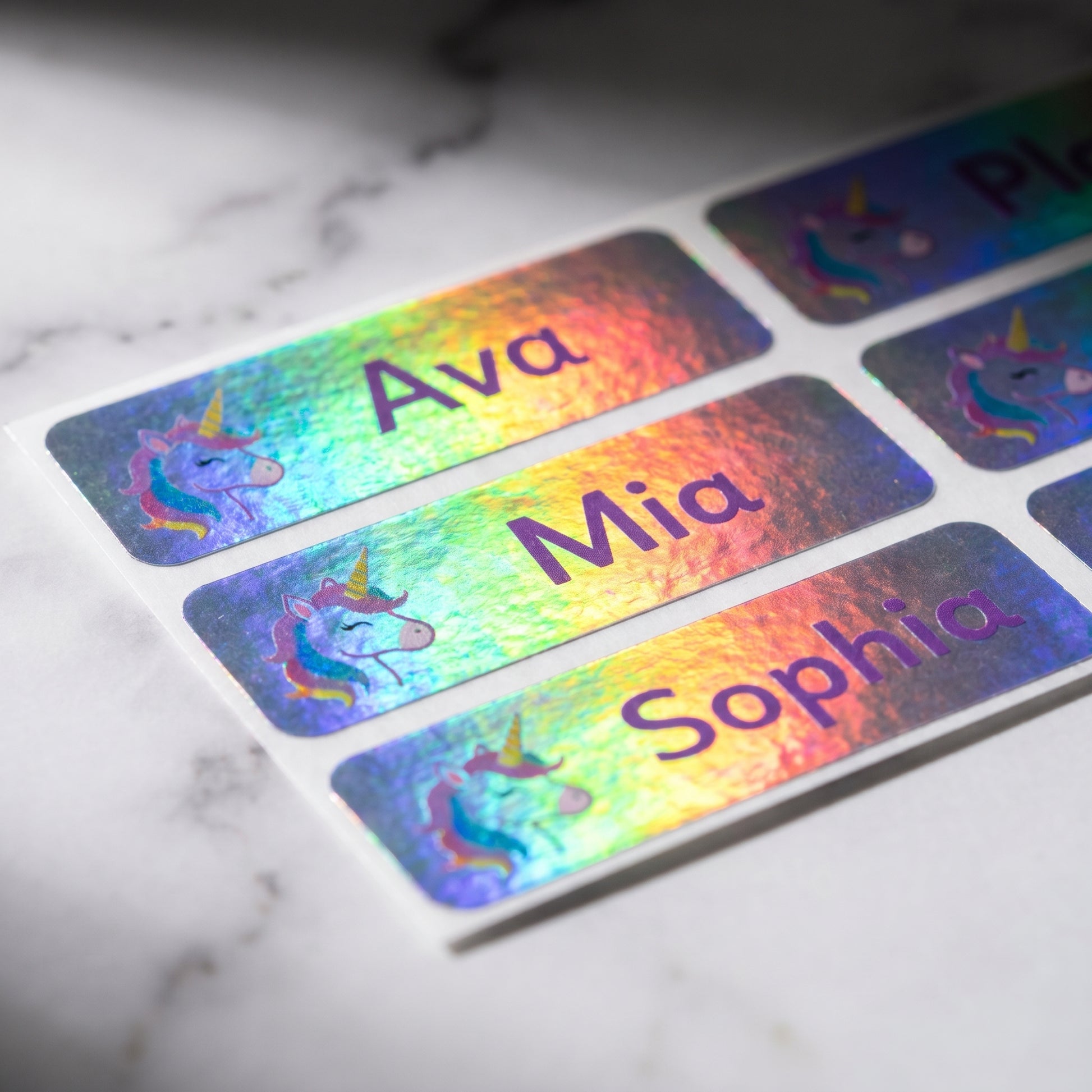 Holographic unicorn name label close-up with rainbow shimmer