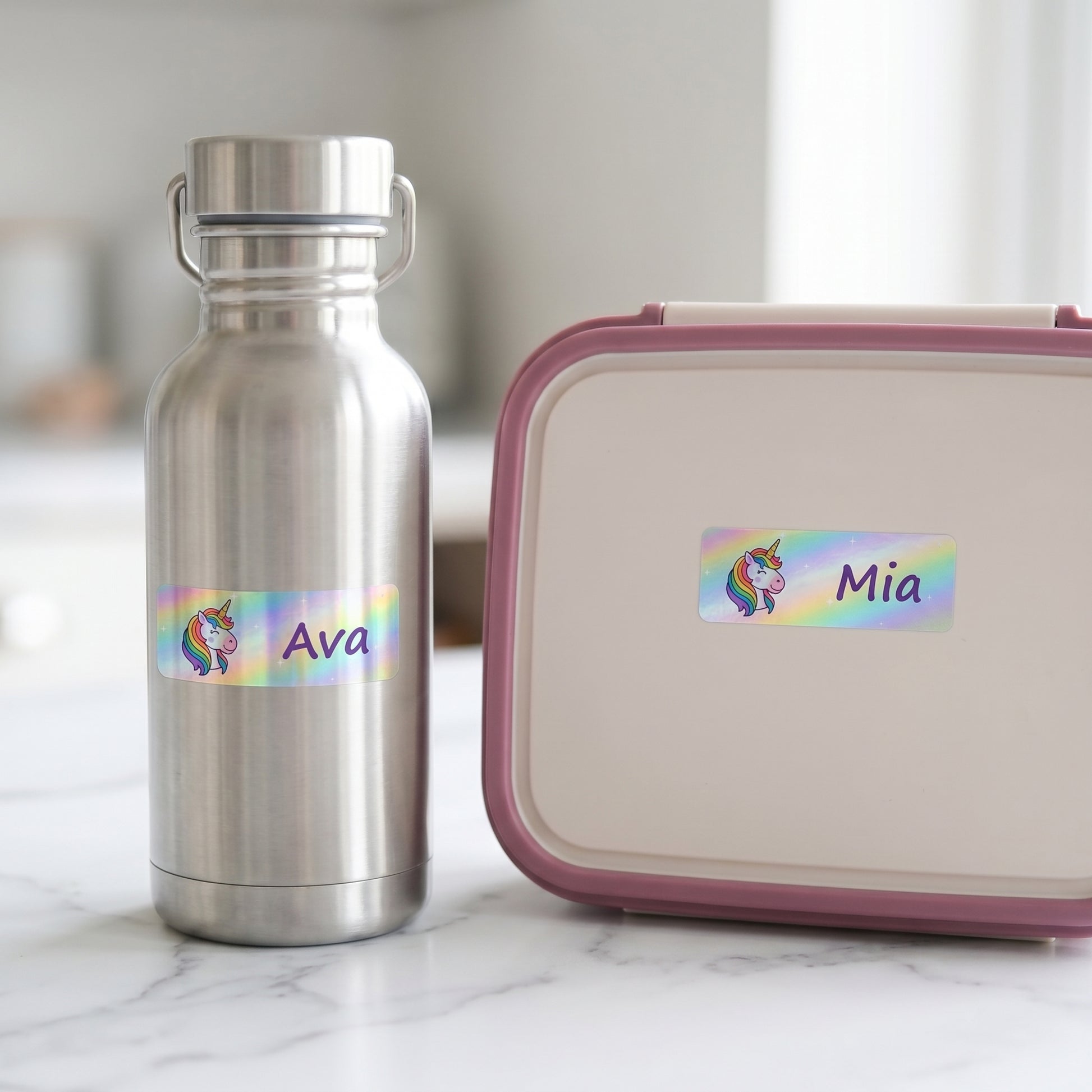 Unicorn name labels on a kids water bottle and lunchbox
