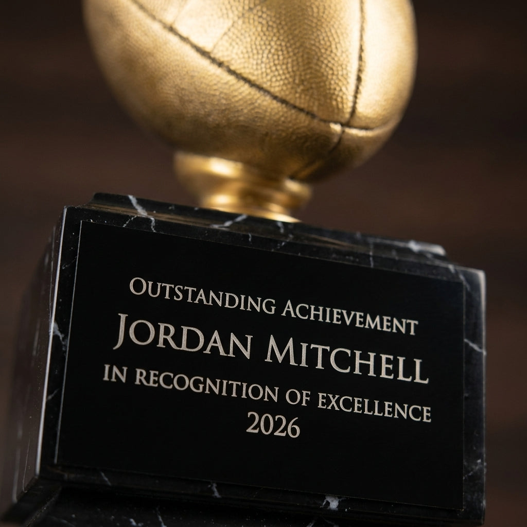 Close-up of the custom laser engraving on a personalized Antique Gold Football Resin Trophy resin award, showing crisp permanent personalization