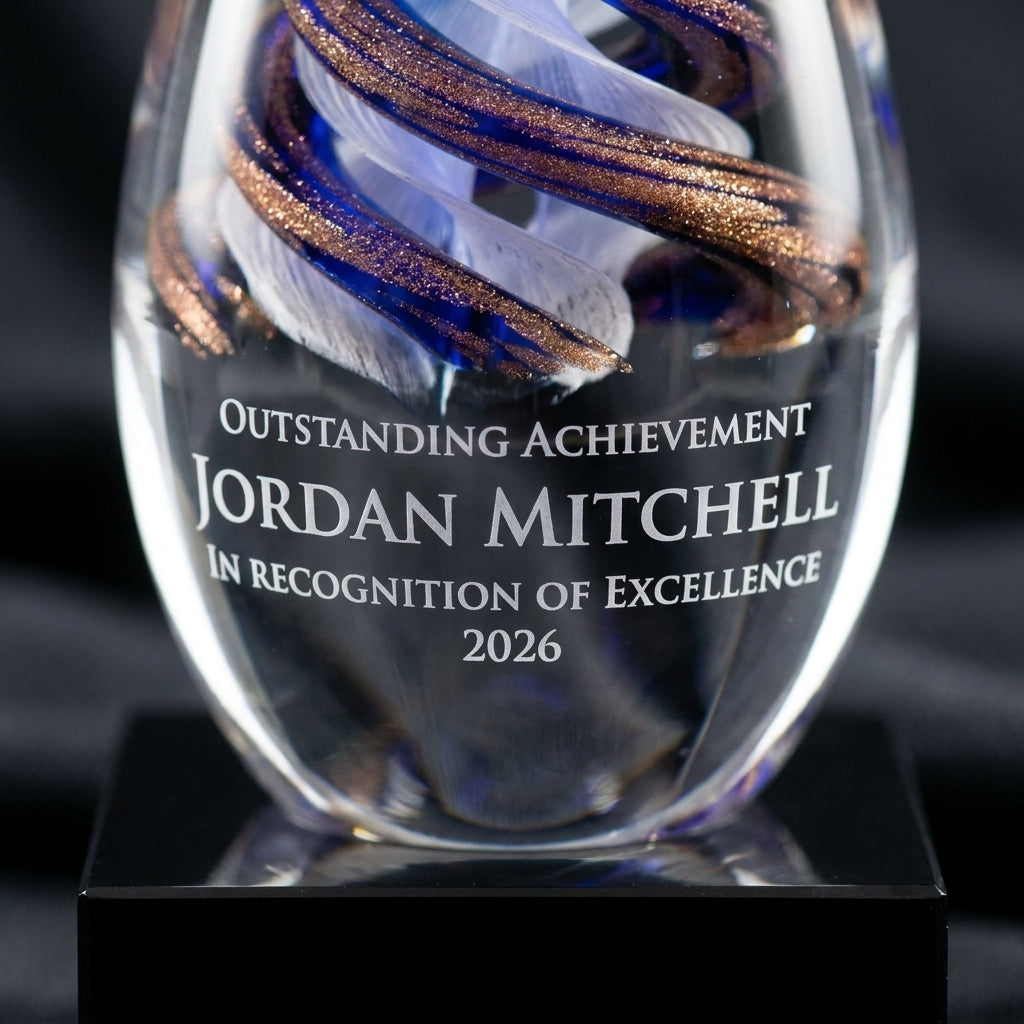 Close-up of the custom laser engraving on a personalized Art Glass art glass award, showing crisp permanent personalization