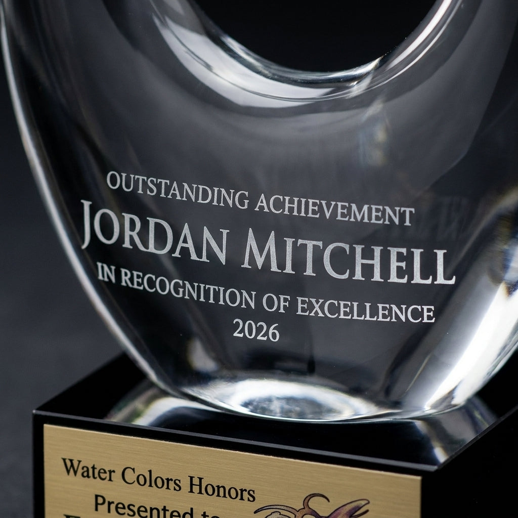 Close-up of the custom laser engraving on a personalized Art Glass art glass award, showing crisp permanent personalization