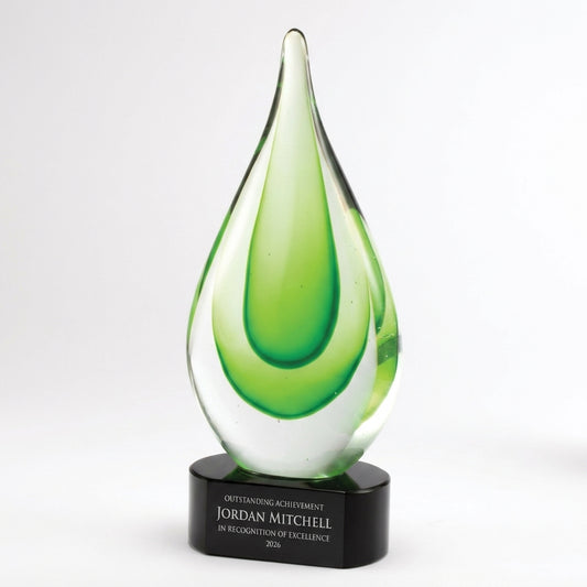 Personalized Green art glass award, custom laser engraved recognition award on a clean white studio background