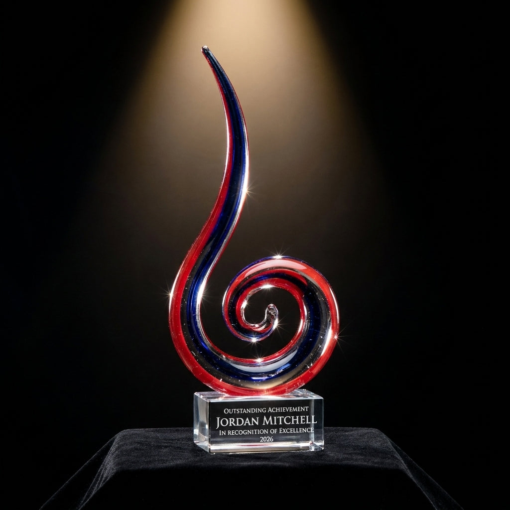 Personalized Red White Blue Spiral art glass award on black velvet under awards-ceremony spotlight, engraved champion and lifetime achievement award