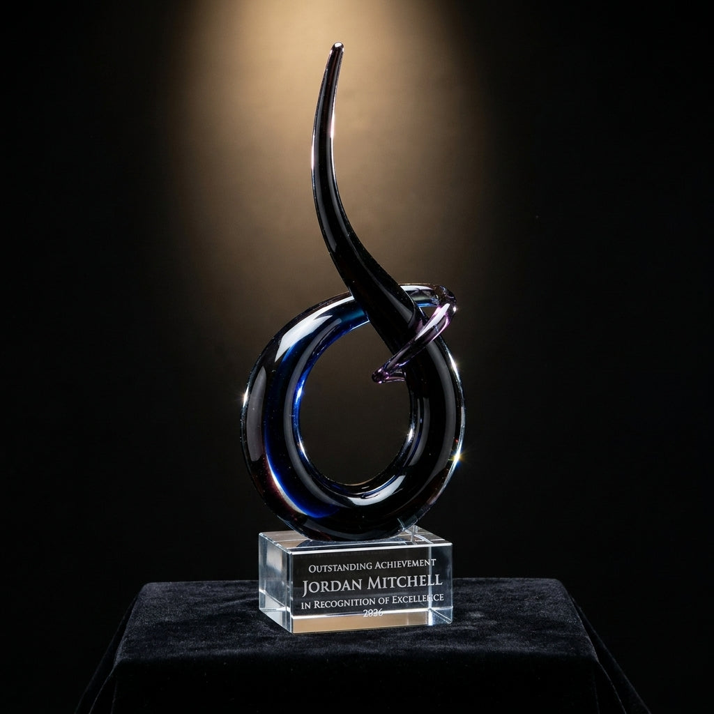 Personalized Sculpture art glass award on black velvet under awards-ceremony spotlight, engraved champion and lifetime achievement award