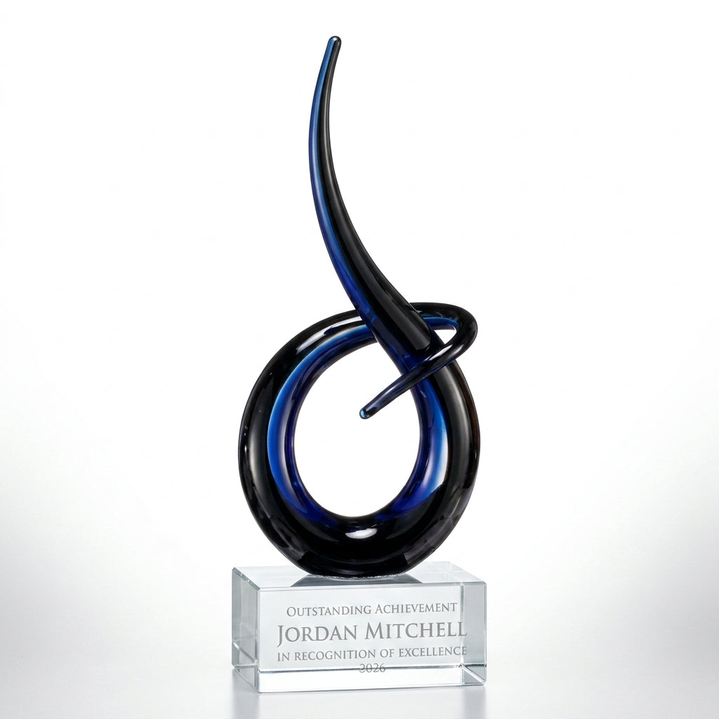 Personalized Midnight Blue Flame Knot art glass award, custom laser engraved recognition award on a clean white studio background