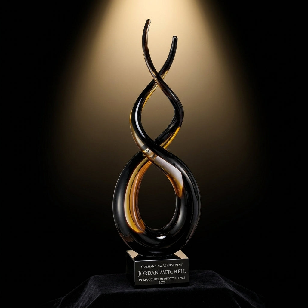 Personalized Sculpture art glass award on black velvet under awards-ceremony spotlight, engraved champion and lifetime achievement award