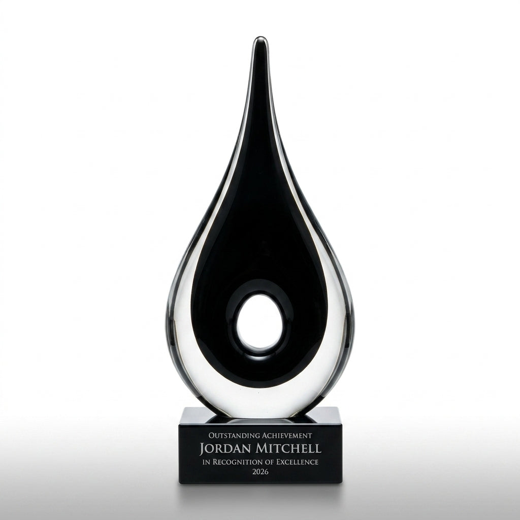 Personalized Black Teardrop Cutout art glass award, custom laser engraved recognition award on a clean white studio background