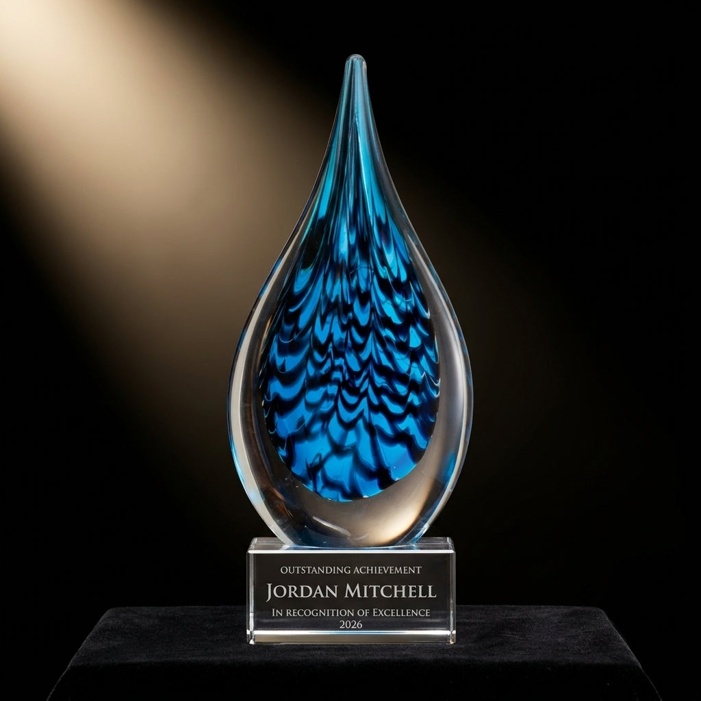 Personalized Sculpture art glass award on black velvet under awards-ceremony spotlight, engraved champion and lifetime achievement award