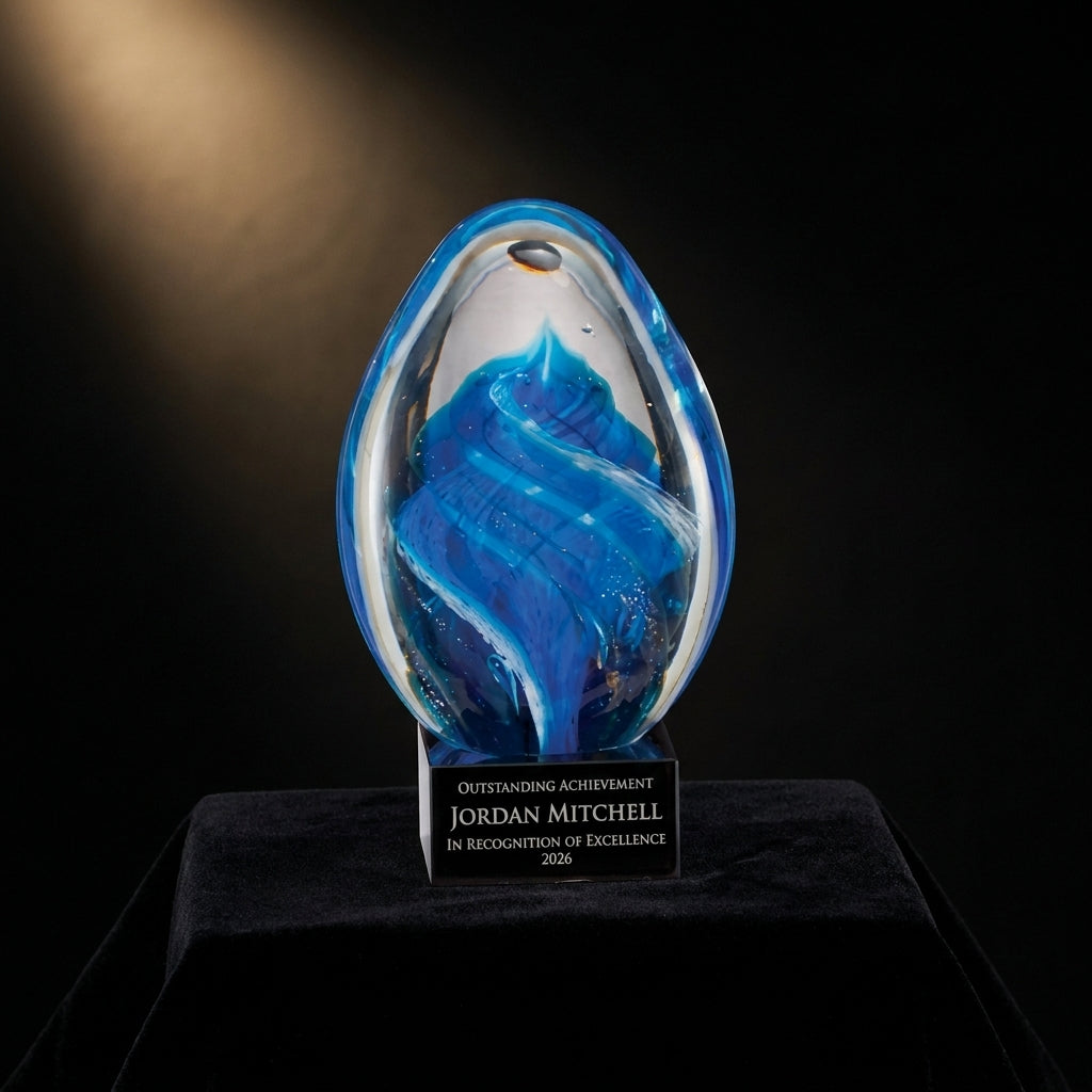 Personalized Sculpture art glass award on black velvet under awards-ceremony spotlight, engraved champion and lifetime achievement award