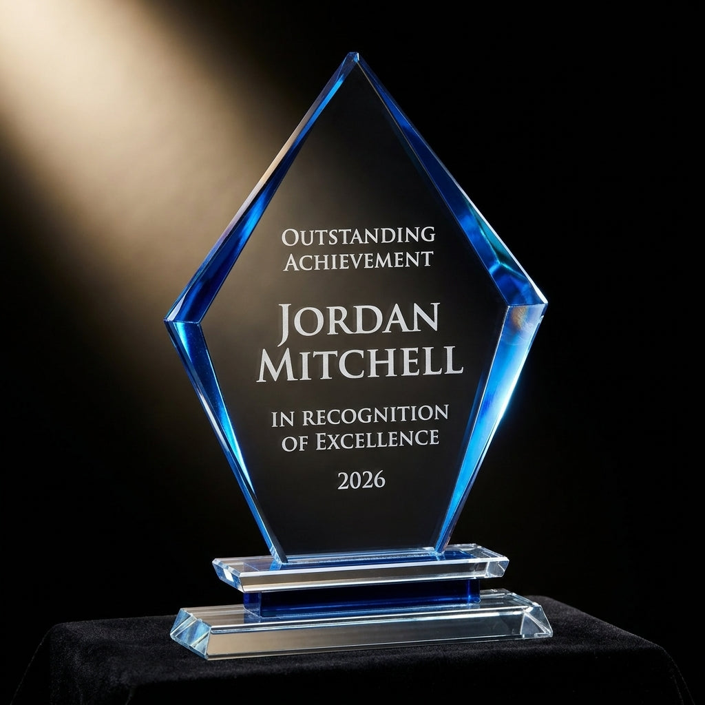 Personalized Black Arrow Clear Base crystal award on black velvet under awards-ceremony spotlight, engraved champion and lifetime achievement award