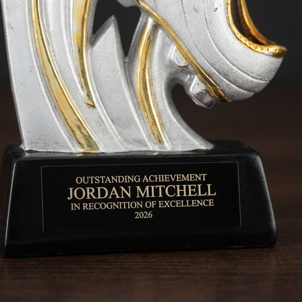 Close-up of the custom laser engraving on a personalized Ceramic Soccer Slam Award resin award, showing crisp permanent personalization