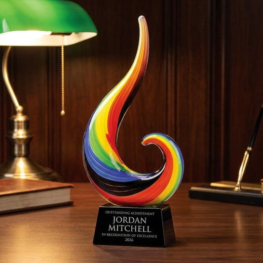 Personalized Color Flame Medium art glass award on a warm executive desk with a green banker's lamp, engraved corporate recognition and retirement gift