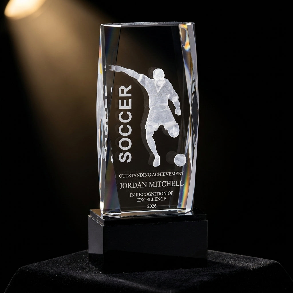 Personalized Crystal Tower 3D Soccer Award crystal award on black velvet under awards-ceremony spotlight, engraved champion and lifetime achievement award
