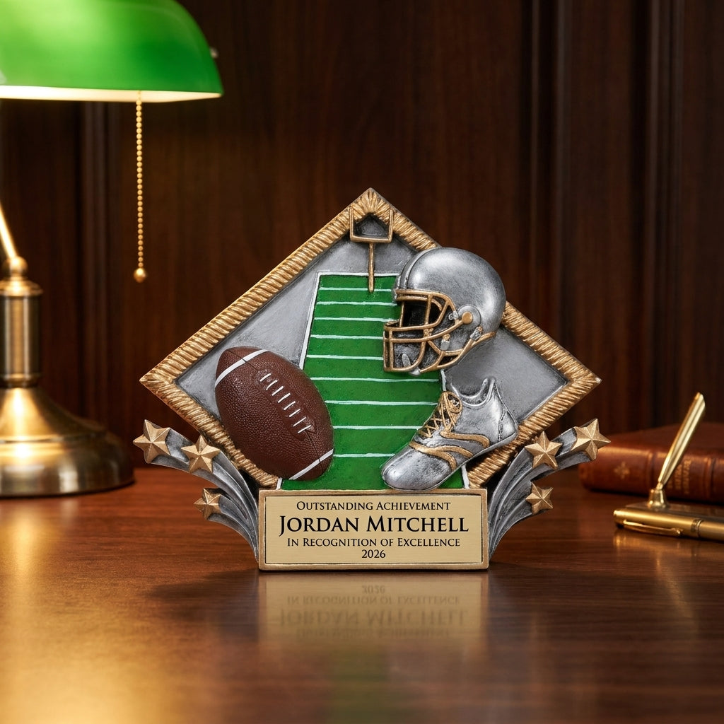 Personalized Football Diamond Plate Resin Award resin award on a warm executive desk with a green banker's lamp, engraved corporate recognition and retirement gift