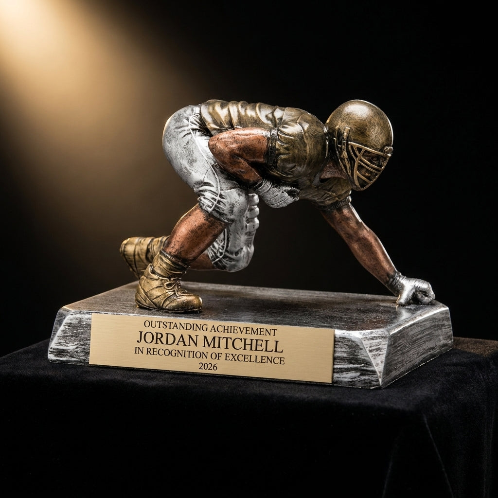 Personalized Football Lineman Resin Trophy resin award on black velvet under awards-ceremony spotlight, engraved champion and lifetime achievement award