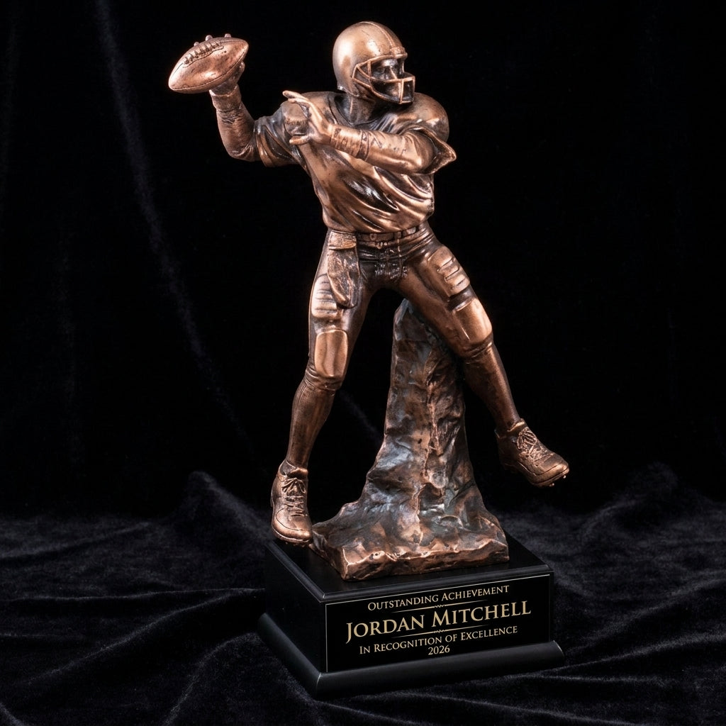 Personalized Football Quarterback Resin Trophy resin award on black velvet under awards-ceremony spotlight, engraved champion and lifetime achievement award