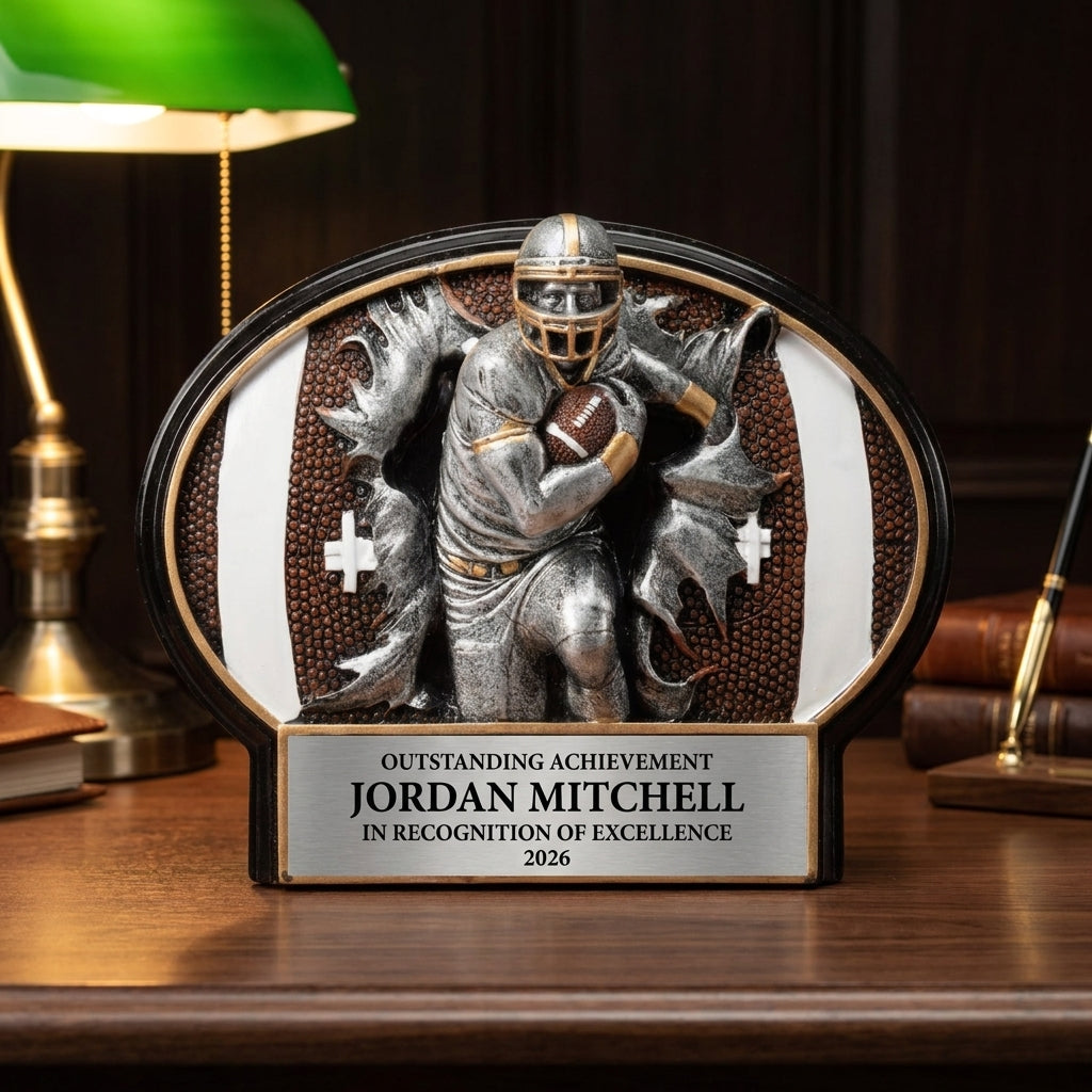 Personalized Football Resin Plaque Award resin award on a warm executive desk with a green banker's lamp, engraved corporate recognition and retirement gift