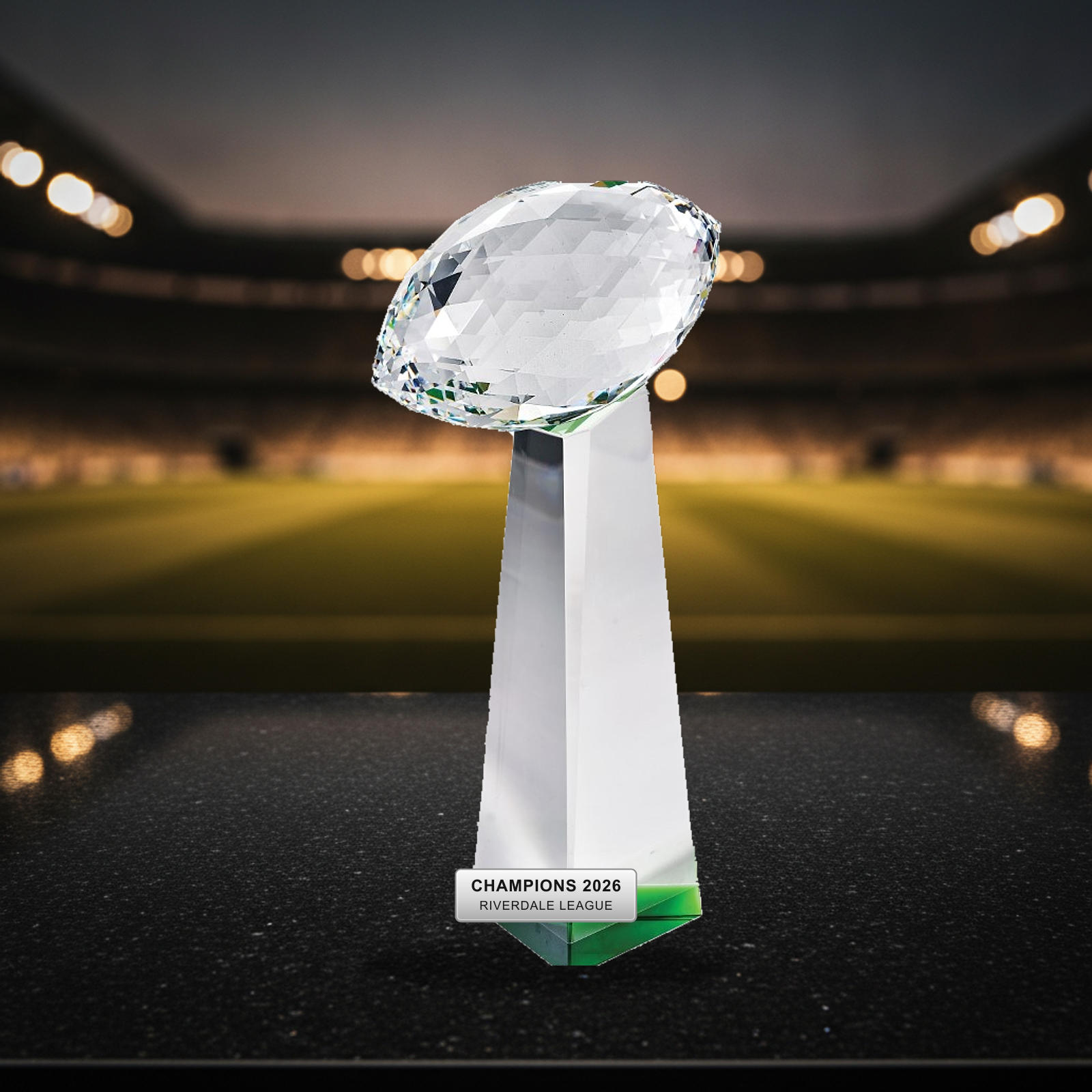 Personalized Optical Crystal Football Tower Award crystal award on a warm executive desk with a green banker's lamp, engraved corporate recognition and retirement gift