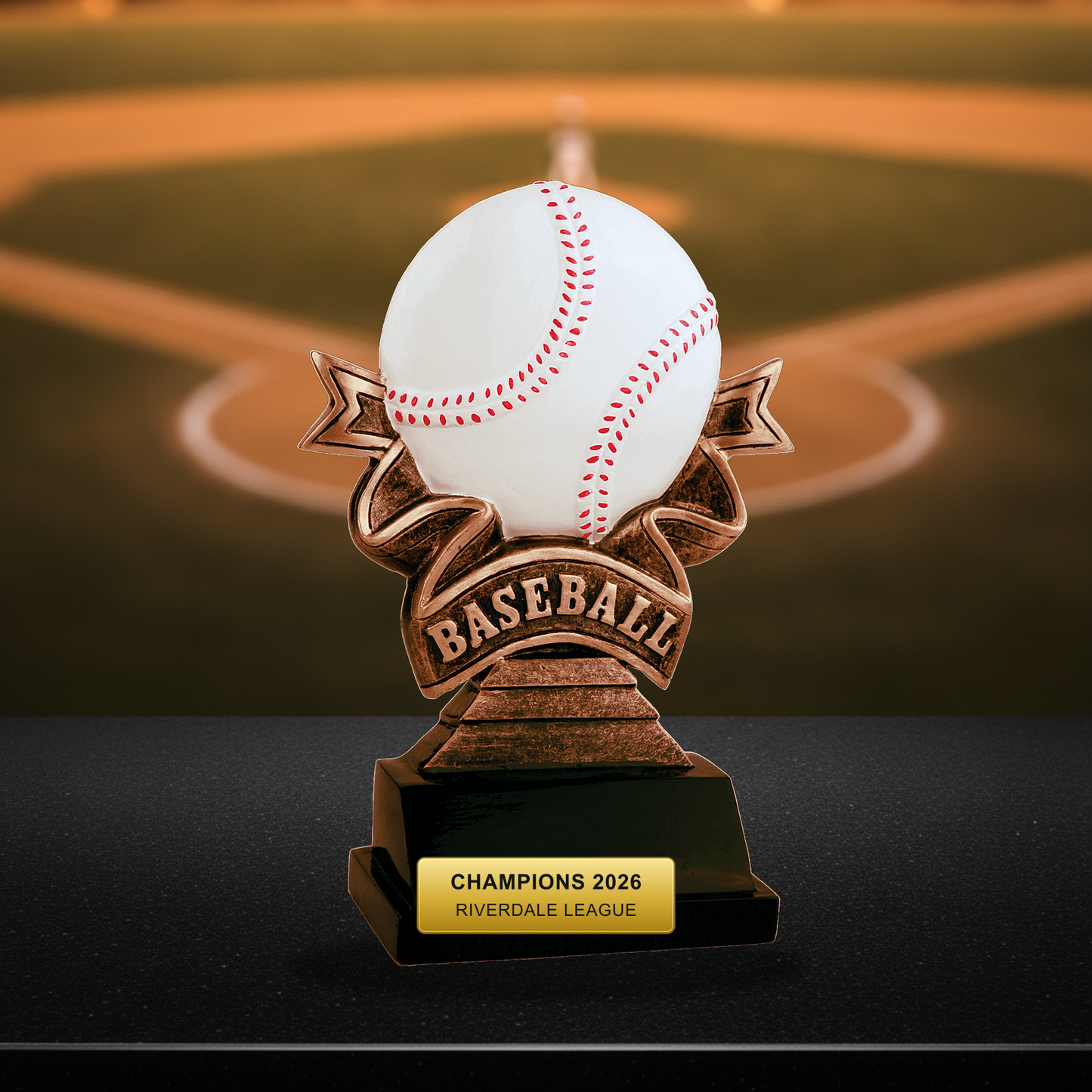 Personalized Baseball Resin Trophy Award resin award on a warm executive desk with a green banker's lamp, engraved corporate recognition and retirement gift