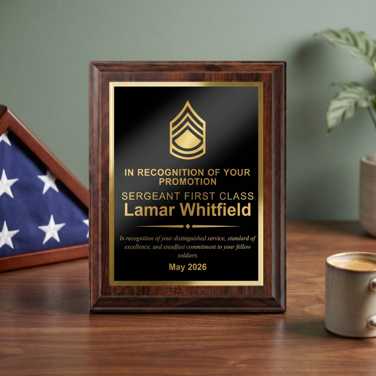 Personalized Army cherry plaque with a Sergeant First Class insignia and name engraved in gold on a black brass plate, styled as a promotion gift on a desk