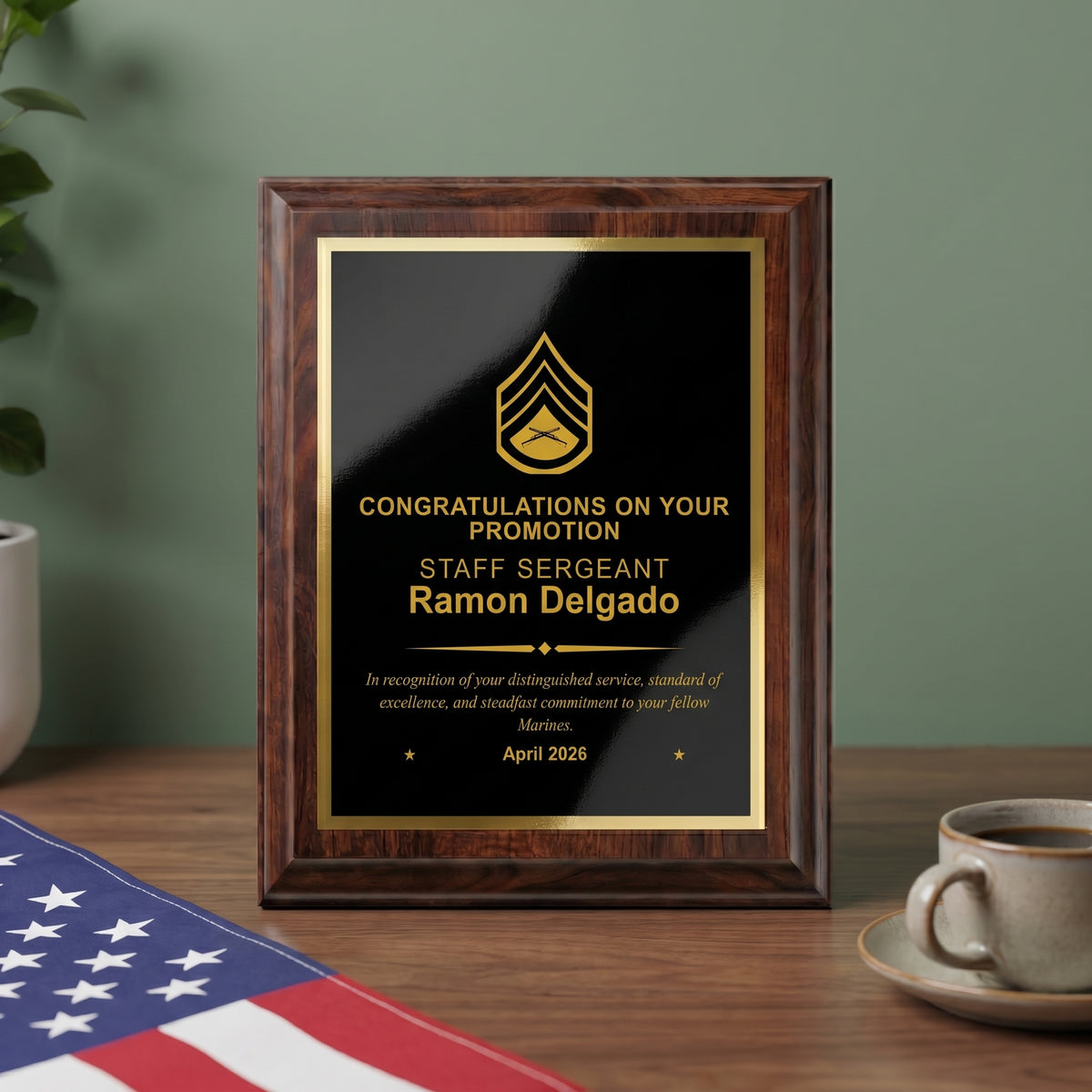 Personalized Marine Corps cherry plaque with a Staff Sergeant insignia and name engraved in gold on a black brass plate, styled as a promotion gift on a desk