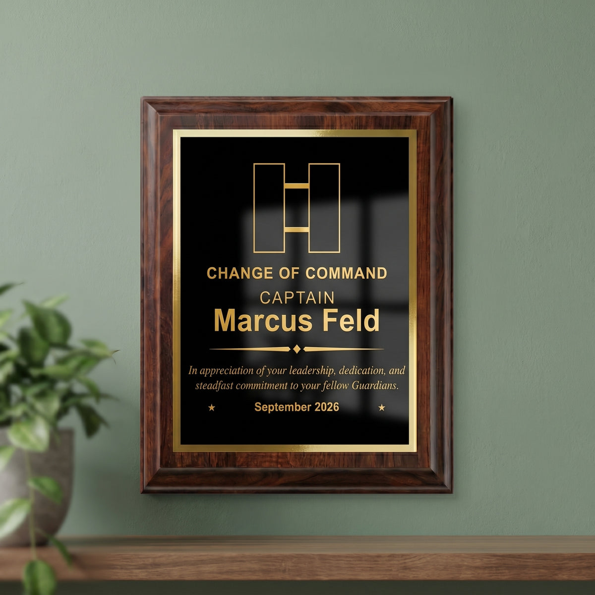 Space Force Captain change of command plaque hanging on a wall, cherry finish with the officer insignia, name, and date engraved in gold