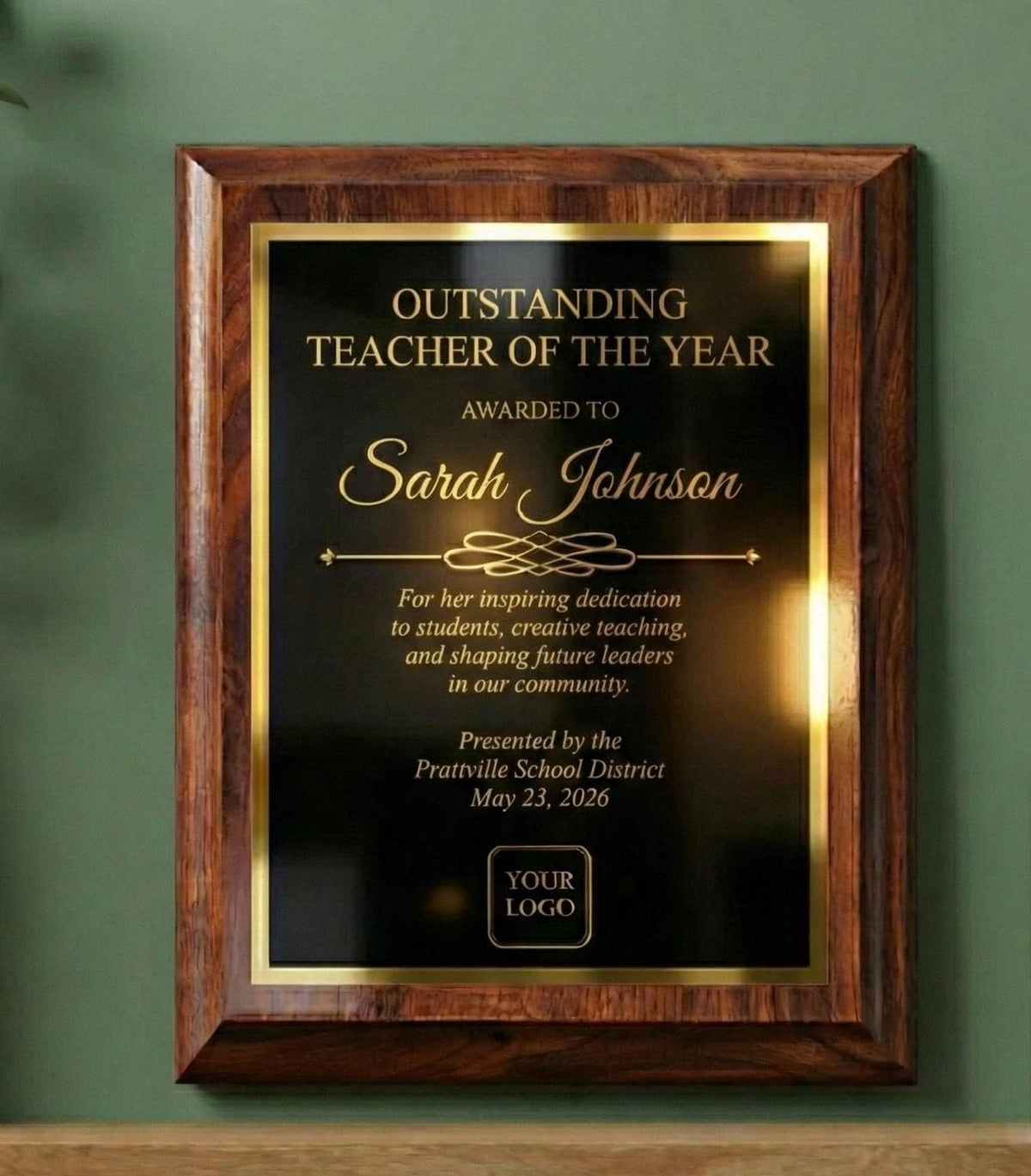 Personalized wooden award plaque with black engraved plate and gold border, Outstanding Teacher of the Year example with custom name, message, date and logo