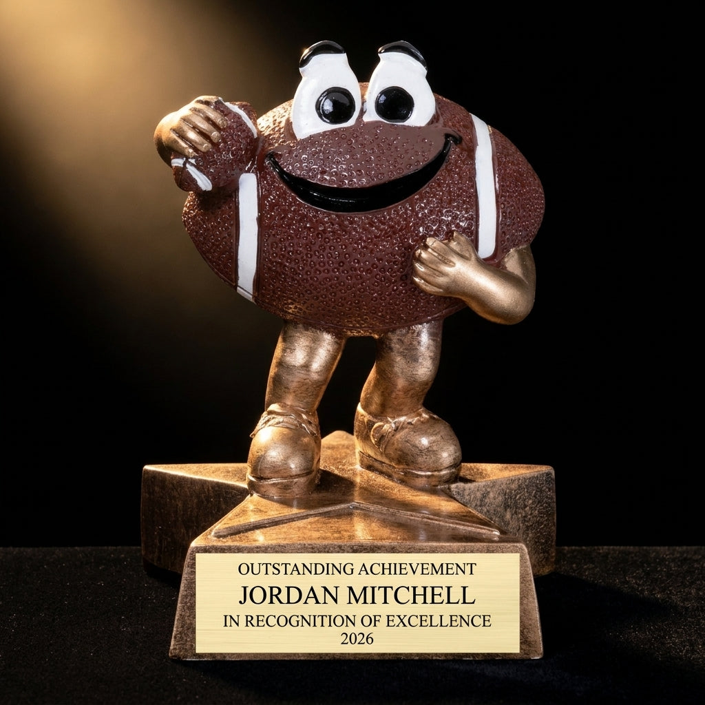 Personalized Little Buddy Football Resin Trophy resin award on black velvet under awards-ceremony spotlight, engraved champion and lifetime achievement award