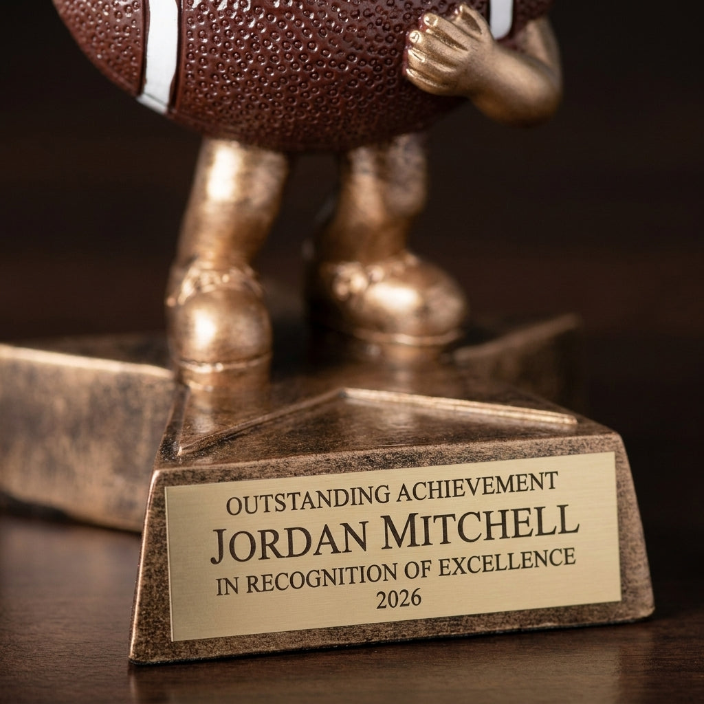 Close-up of the custom laser engraving on a personalized Little Buddy Football Resin Trophy resin award, showing crisp permanent personalization