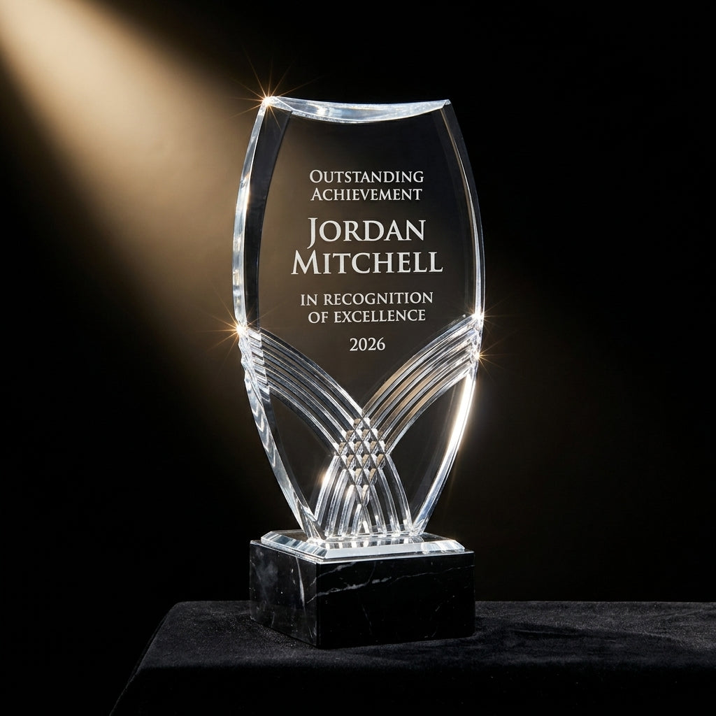 Personalized Nile Tower Black acrylic award on black velvet under awards-ceremony spotlight, engraved champion and lifetime achievement award