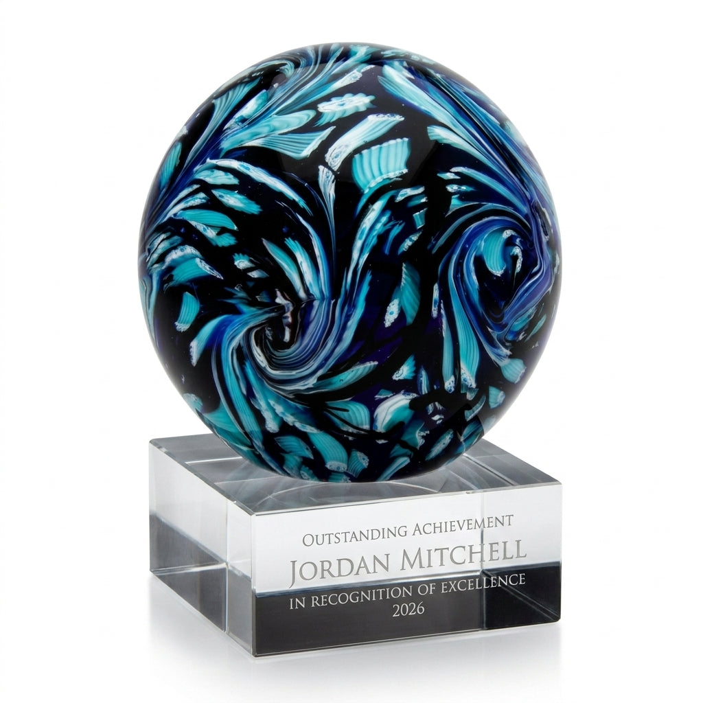 Personalized Swirl Globe Blue art glass award, custom laser engraved recognition award on a clean white studio background