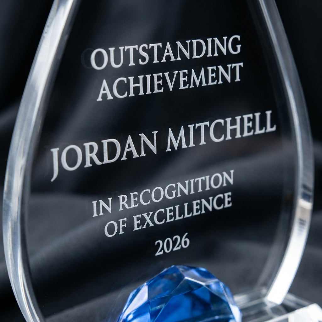 Close-up of the custom laser engraving on a personalized Teardrop Lucite with Glass acrylic award, showing crisp permanent personalization