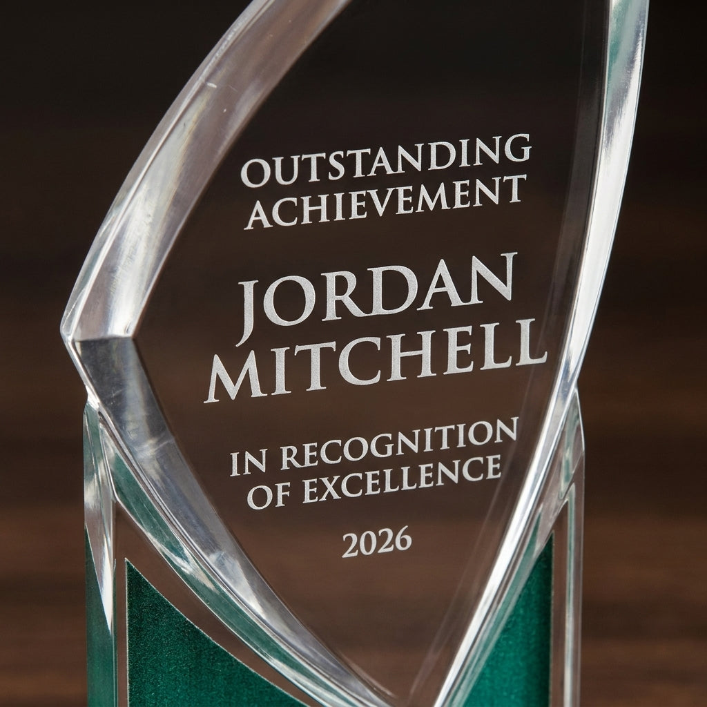 Close-up of the custom laser engraving on a personalized Zenith Green acrylic award, showing crisp permanent personalization